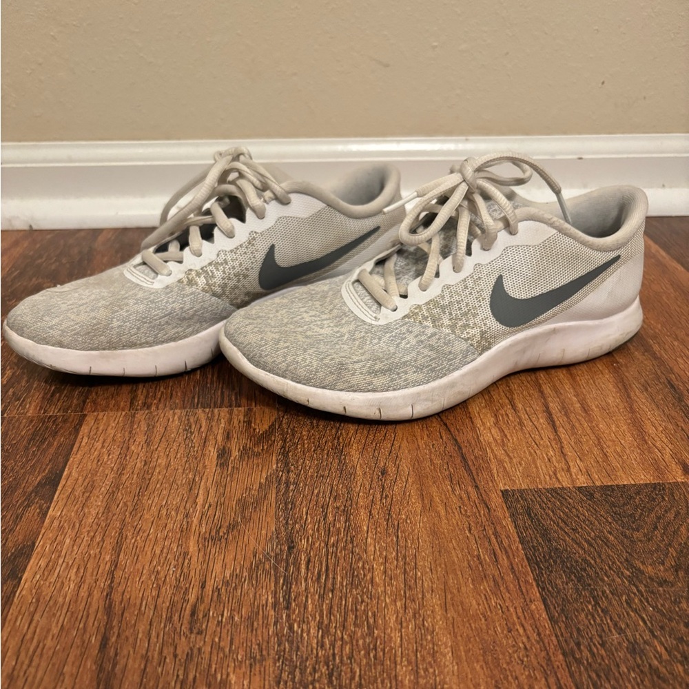 Women’s white and gray Nike Flex sneakers
